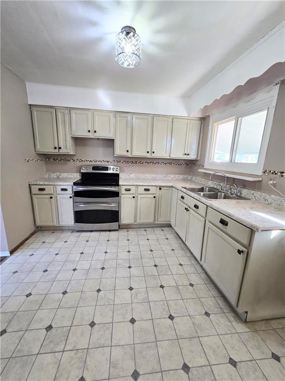 223 Emerson Avenue Farrell, PA 16121 - Photo 13 of 25 a kitchen with stainless steel appliances a sink and cabinets