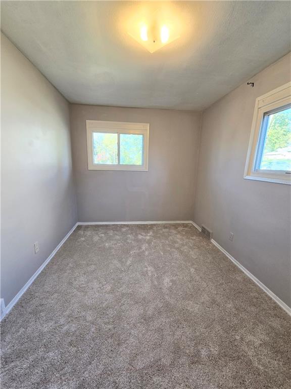 223 Emerson Avenue Farrell, PA 16121 - Photo 18 of 25 an empty room with windows