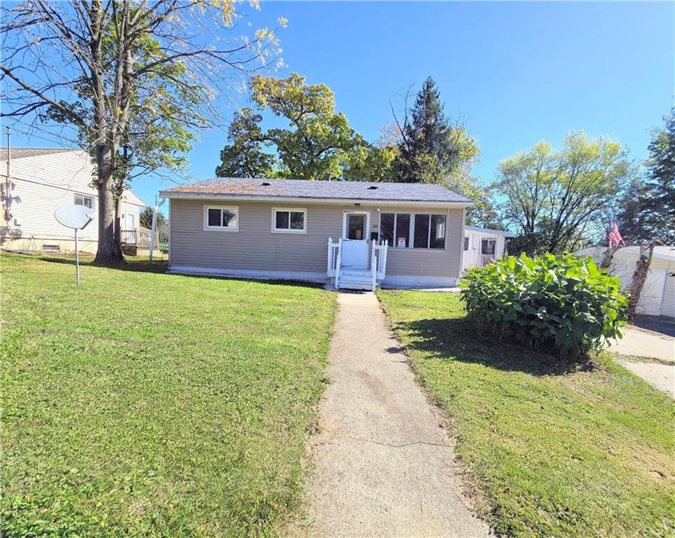 223 Emerson Avenue Farrell, PA 16121 - Photo 2 of 25 a house view with a garden space