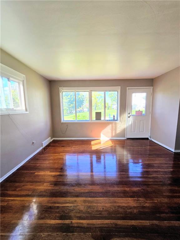 223 Emerson Avenue Farrell, PA 16121 - Photo 7 of 25 a view of empty room with wooden floor