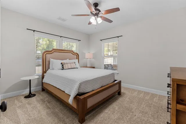 a bedroom with a bed and window