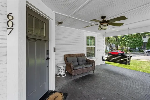 a sitting area with furniture and garden view