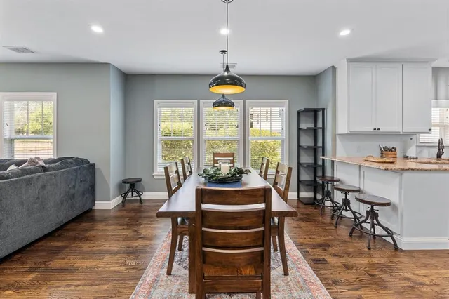 a living room with furniture fireplace and window