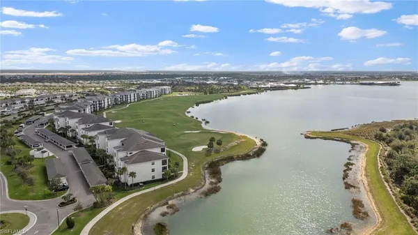 an aerial view of a golf course with swimming pool