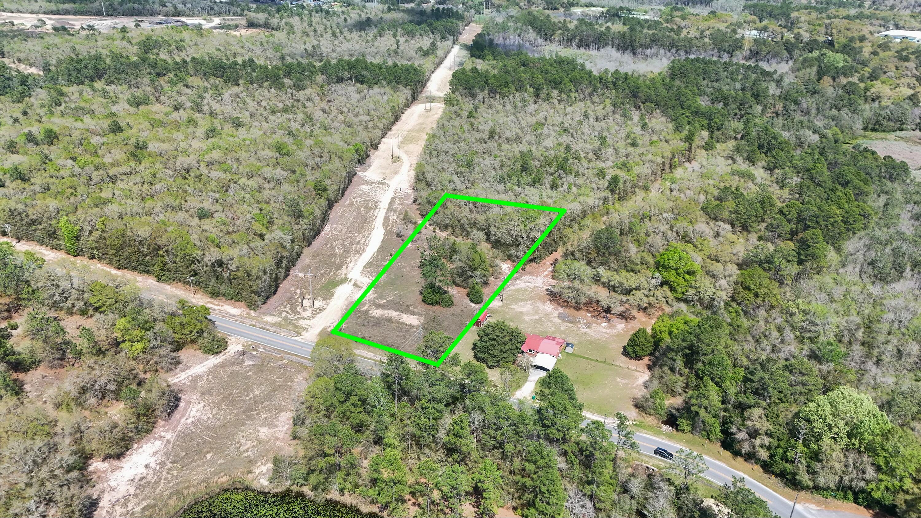 a bird view of a house with a yard