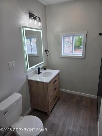 a bathroom with a toilet a sink and bathtub