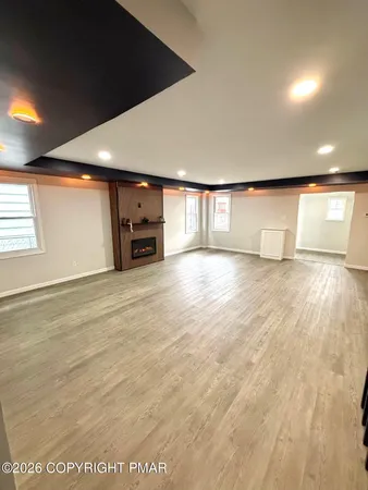 a kitchen with white cabinets and appliances