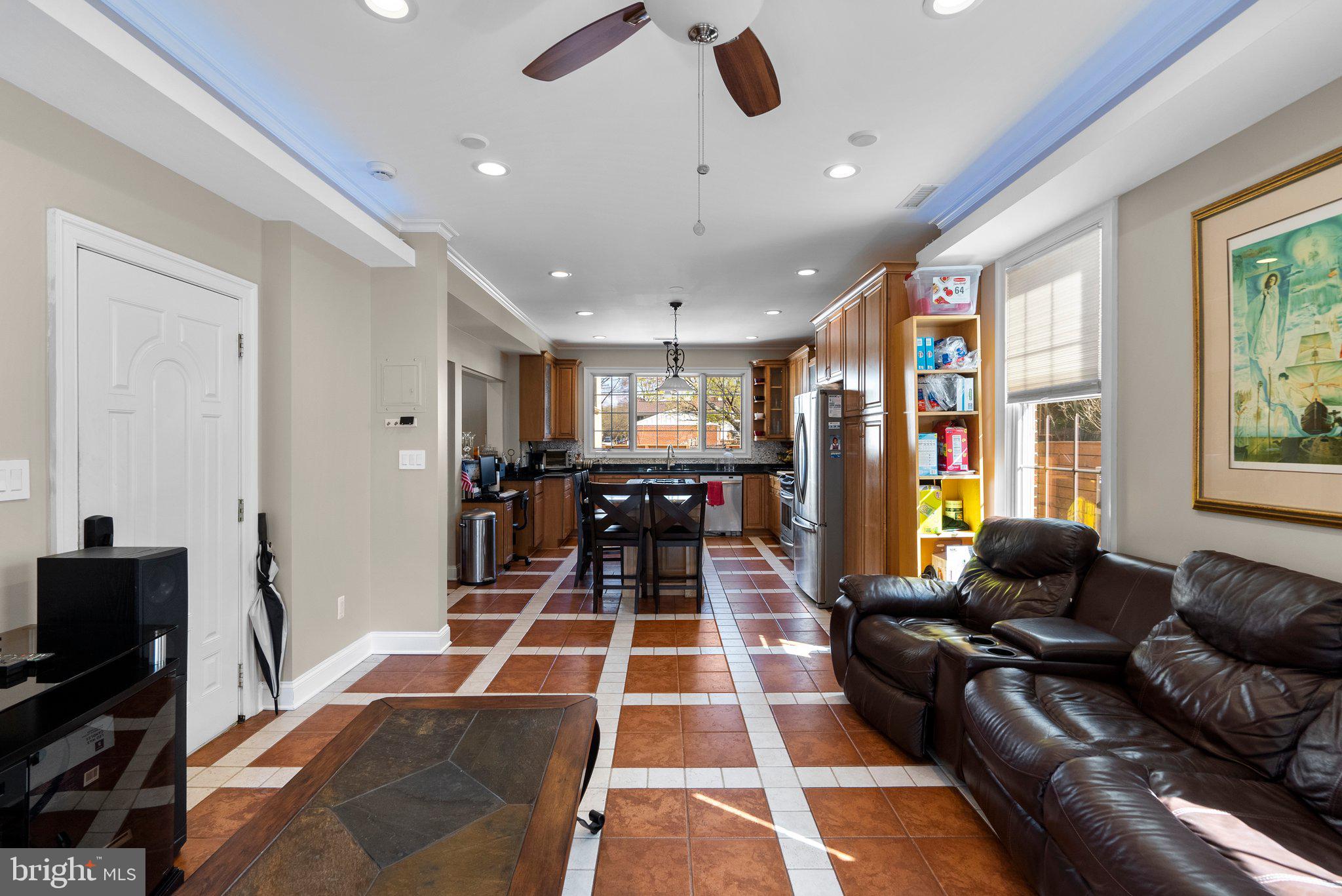 13131 Holdridge Road Silver Spring, MD 20906 - Photo 14 of 41 a living room with furniture and a flat screen tv