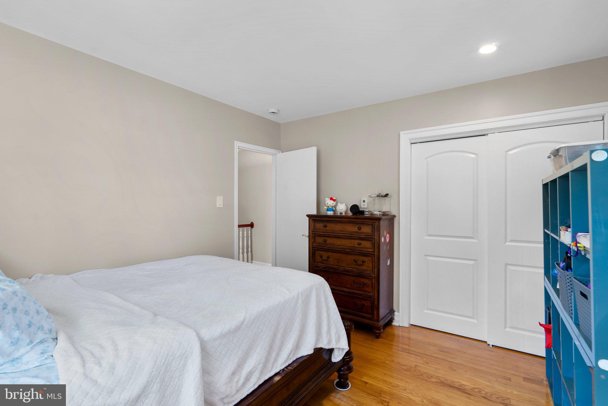 13131 Holdridge Road Silver Spring, MD 20906 - Photo 24 of 41 a bedroom with a bed and wooden floor