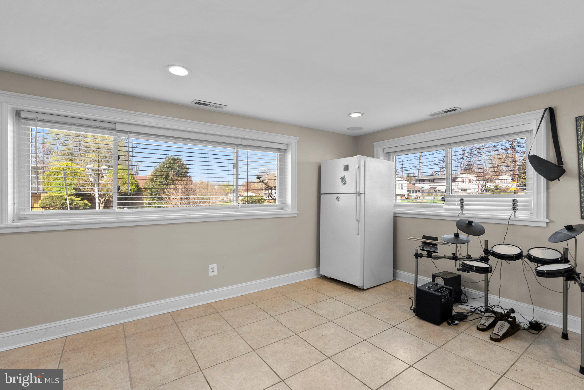 13131 Holdridge Road Silver Spring, MD 20906 - Photo 27 of 41 a view of a kitchen with refrigerator and window