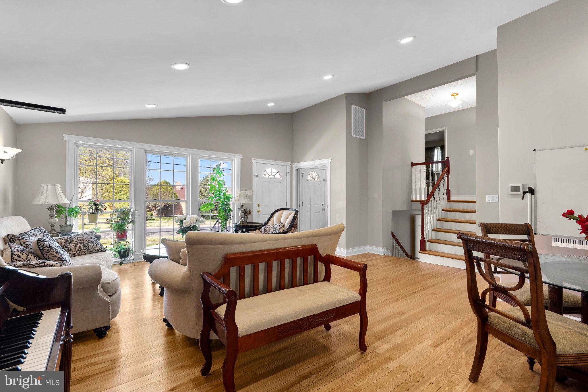 13131 Holdridge Road Silver Spring, MD 20906 - Photo 7 of 41 a living room with furniture and a wooden floor
