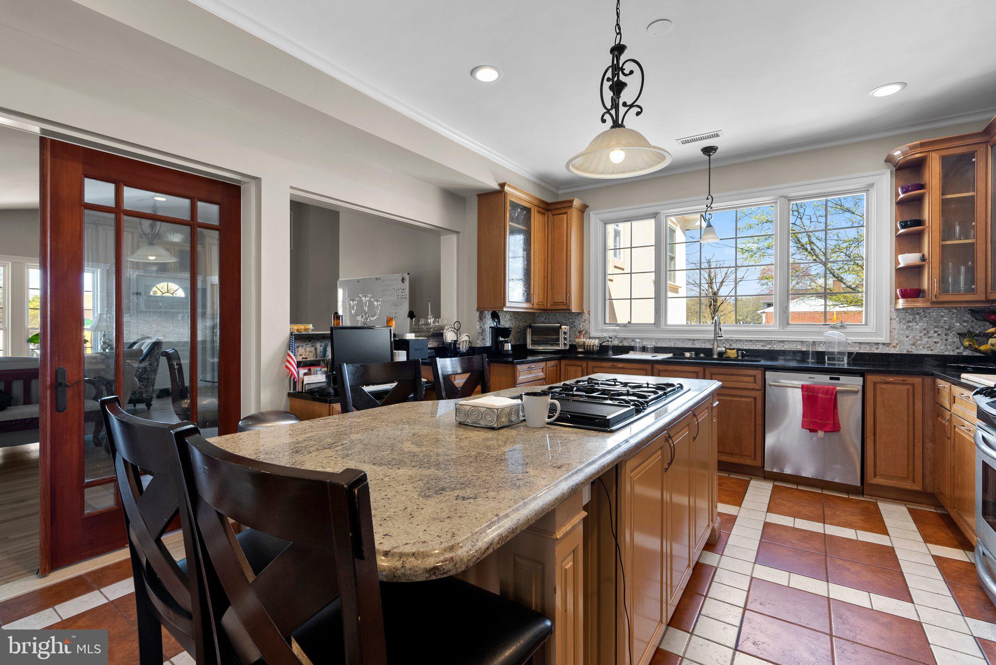 13131 Holdridge Road Silver Spring, MD 20906 - Photo 10 of 41 a kitchen with granite countertop a sink a counter top space appliances and cabinets