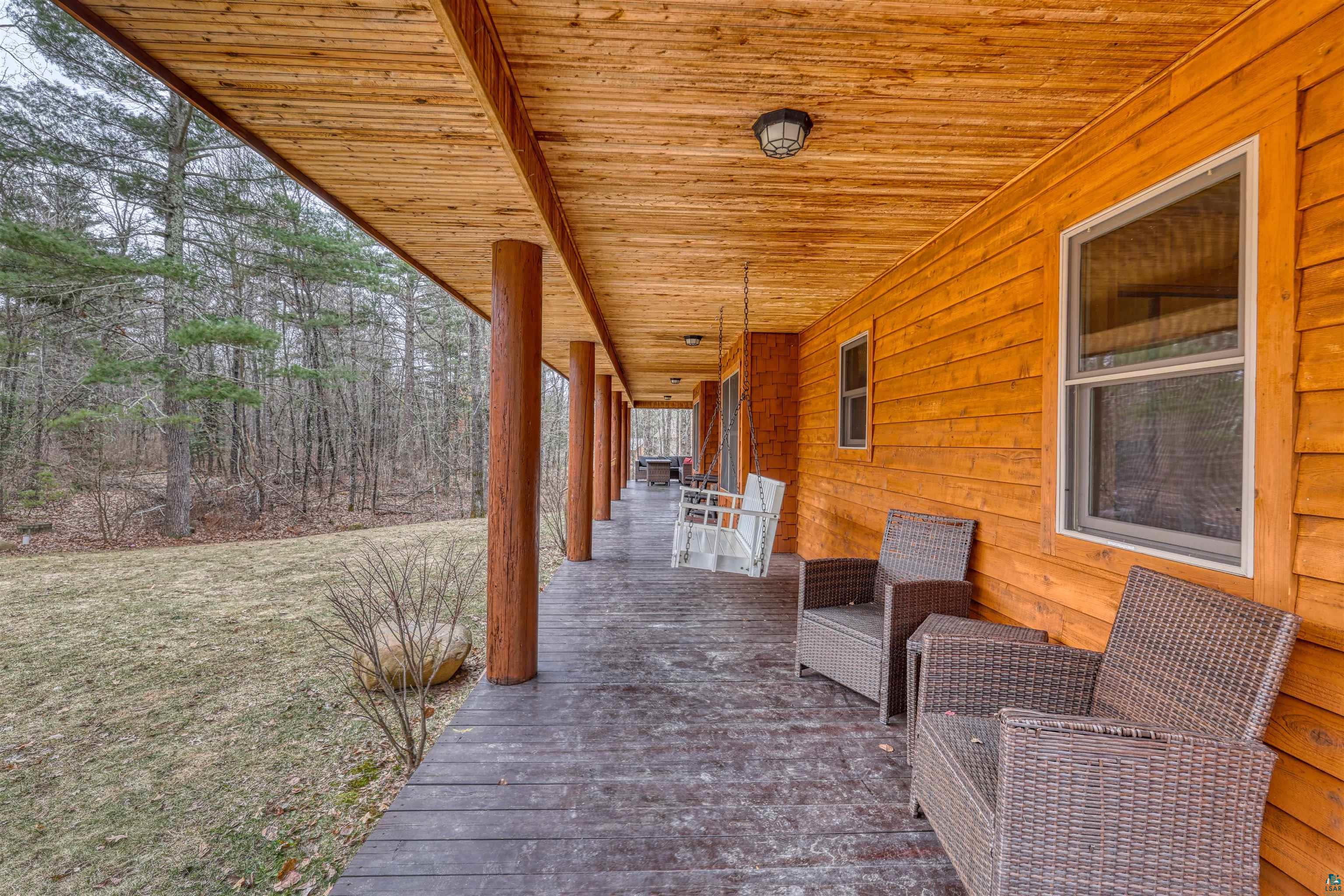 16539 Acorn Ridge Hayward, WI 54843 - Photo 11 of 58 Porch featuring a lawn