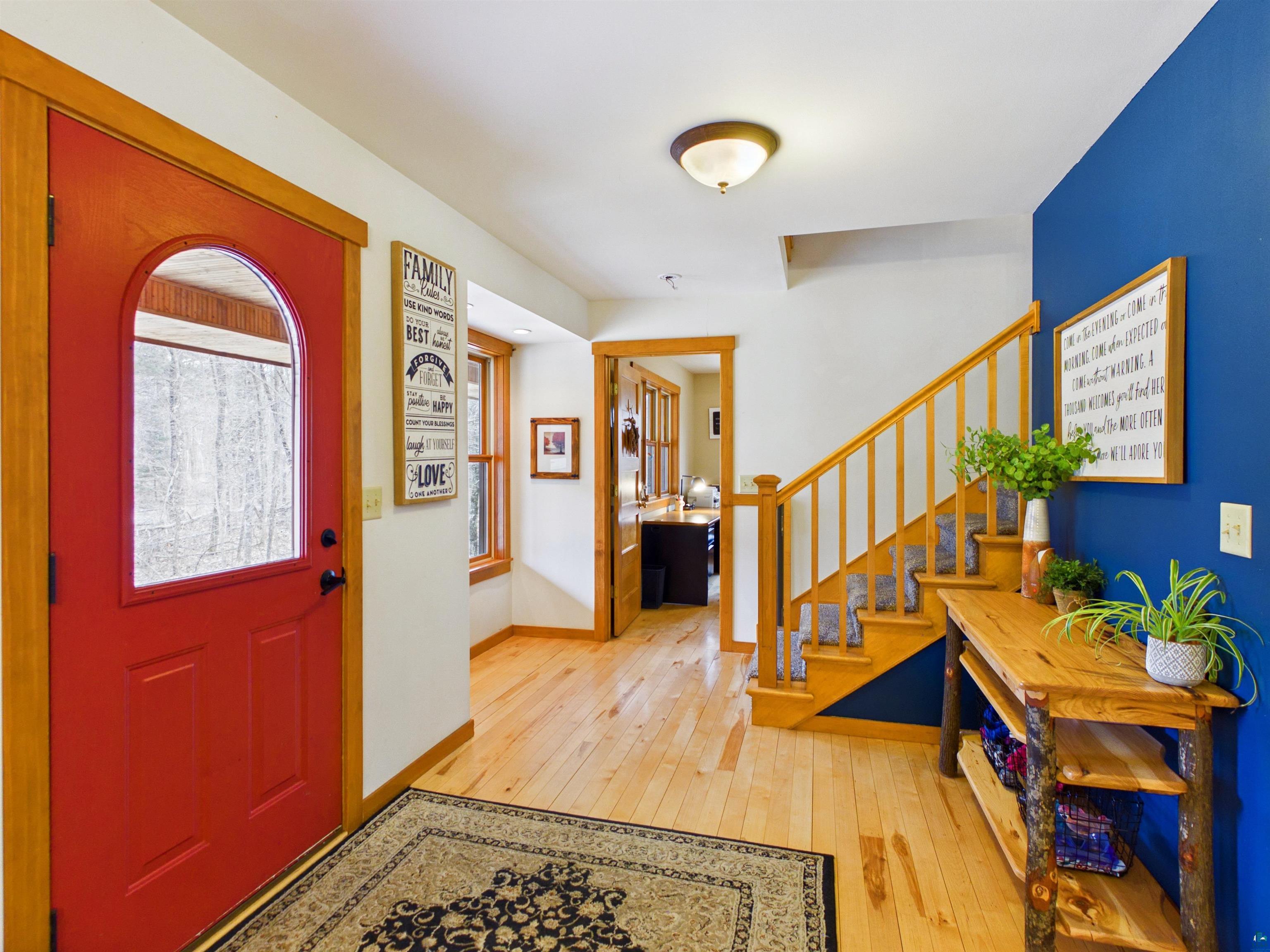 16539 Acorn Ridge Hayward, WI 54843 - Photo 14 of 58 Entrance foyer with light wood-style floors and stairway