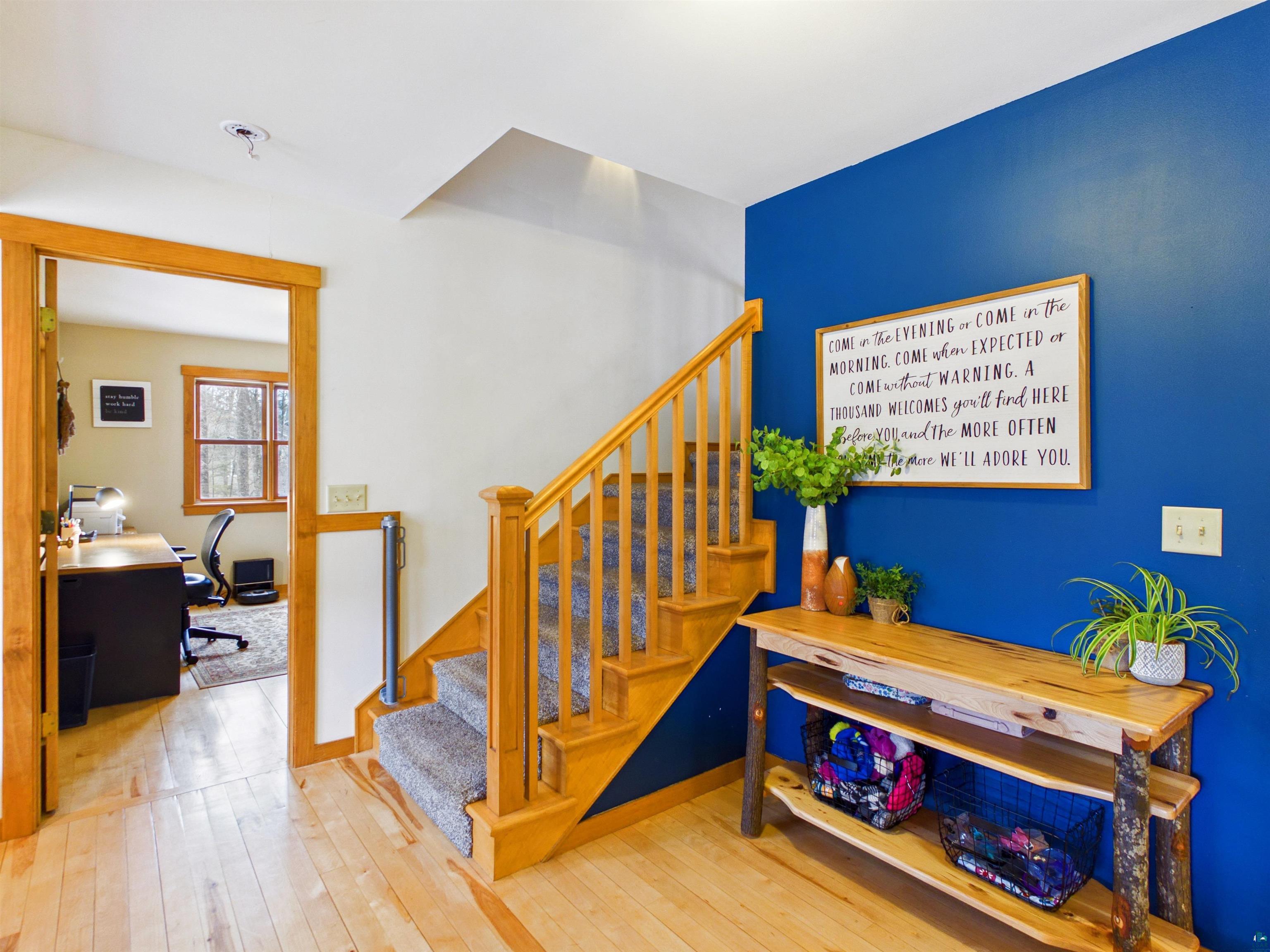 16539 Acorn Ridge Hayward, WI 54843 - Photo 15 of 58 Staircase with hardwood / wood-style flooring