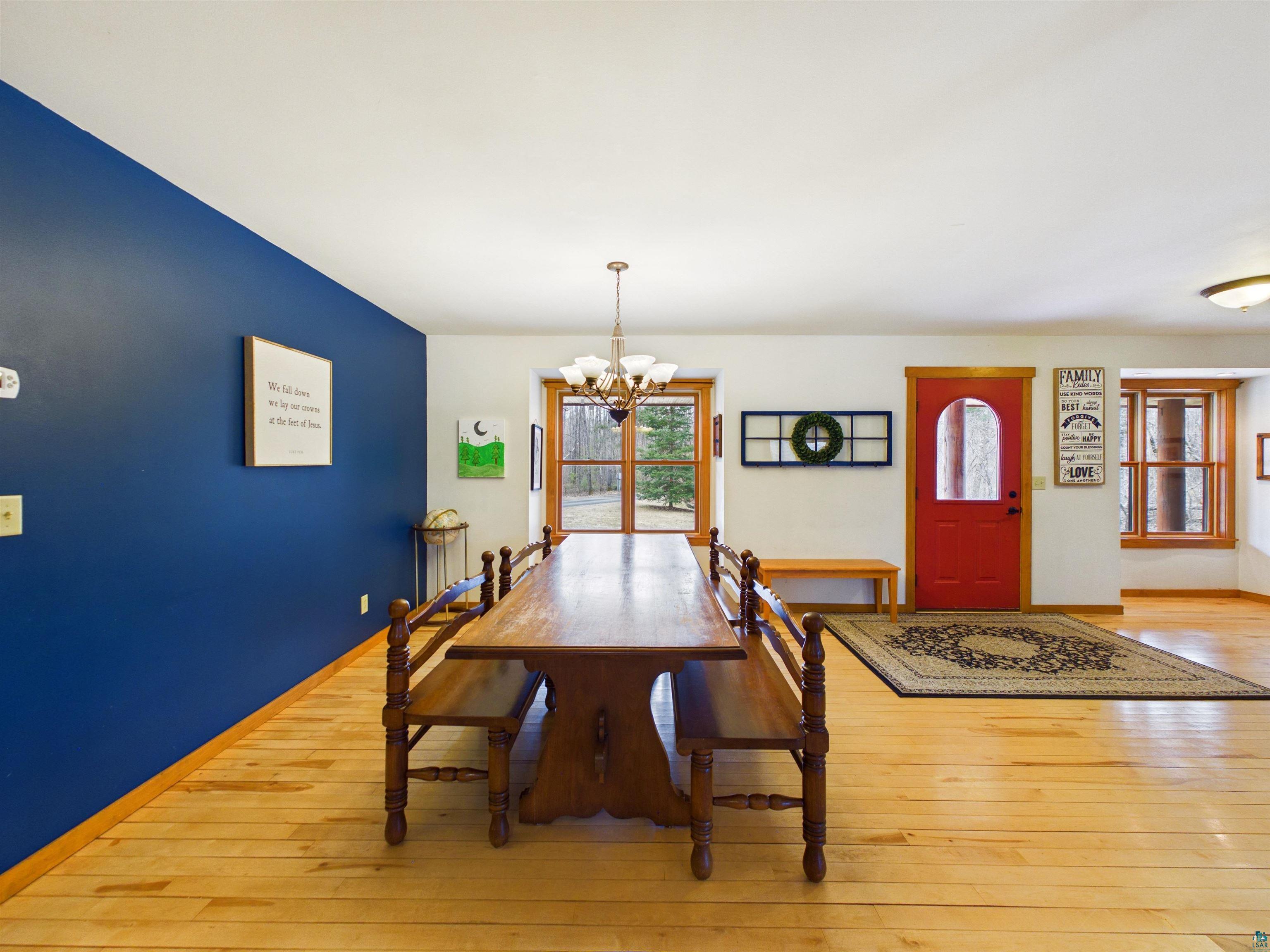 16539 Acorn Ridge Hayward, WI 54843 - Photo 28 of 58 Dining area with light wood-style flooring and hanging lights