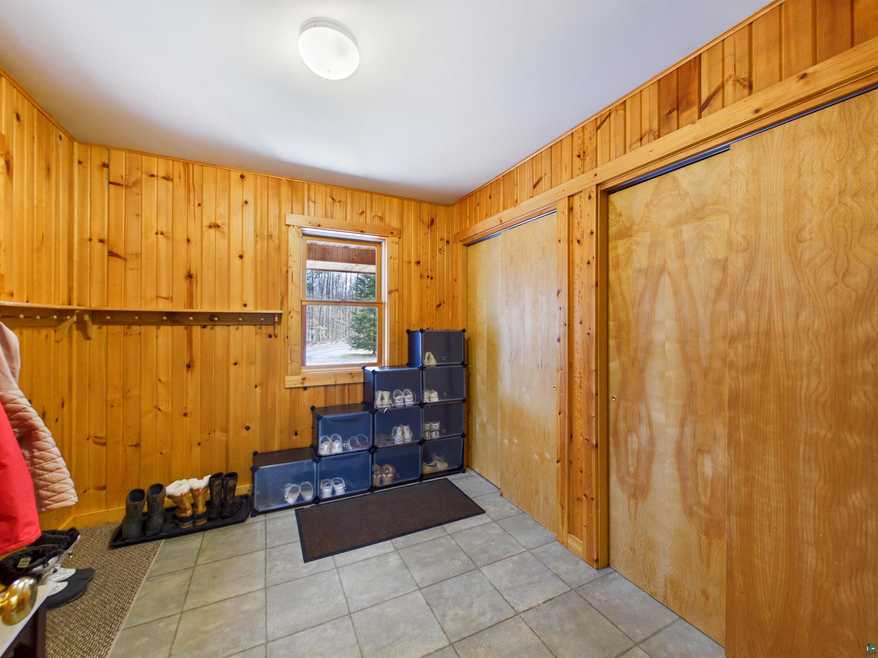 16539 Acorn Ridge Hayward, WI 54843 - Photo 32 of 58 Interior space with wood walls