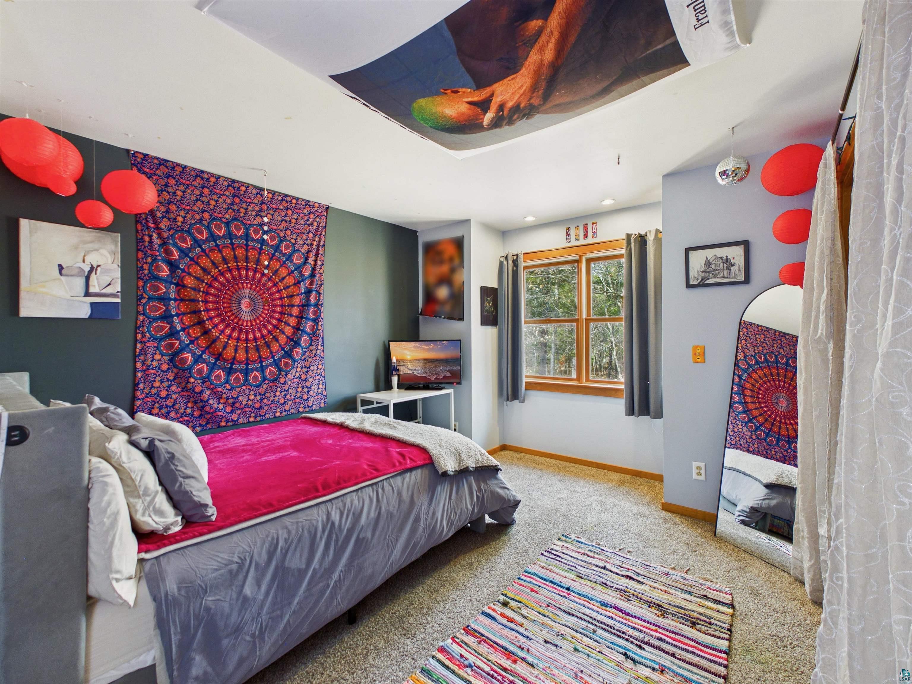 16539 Acorn Ridge Hayward, WI 54843 - Photo 41 of 58 Bedroom featuring light carpet and baseboards