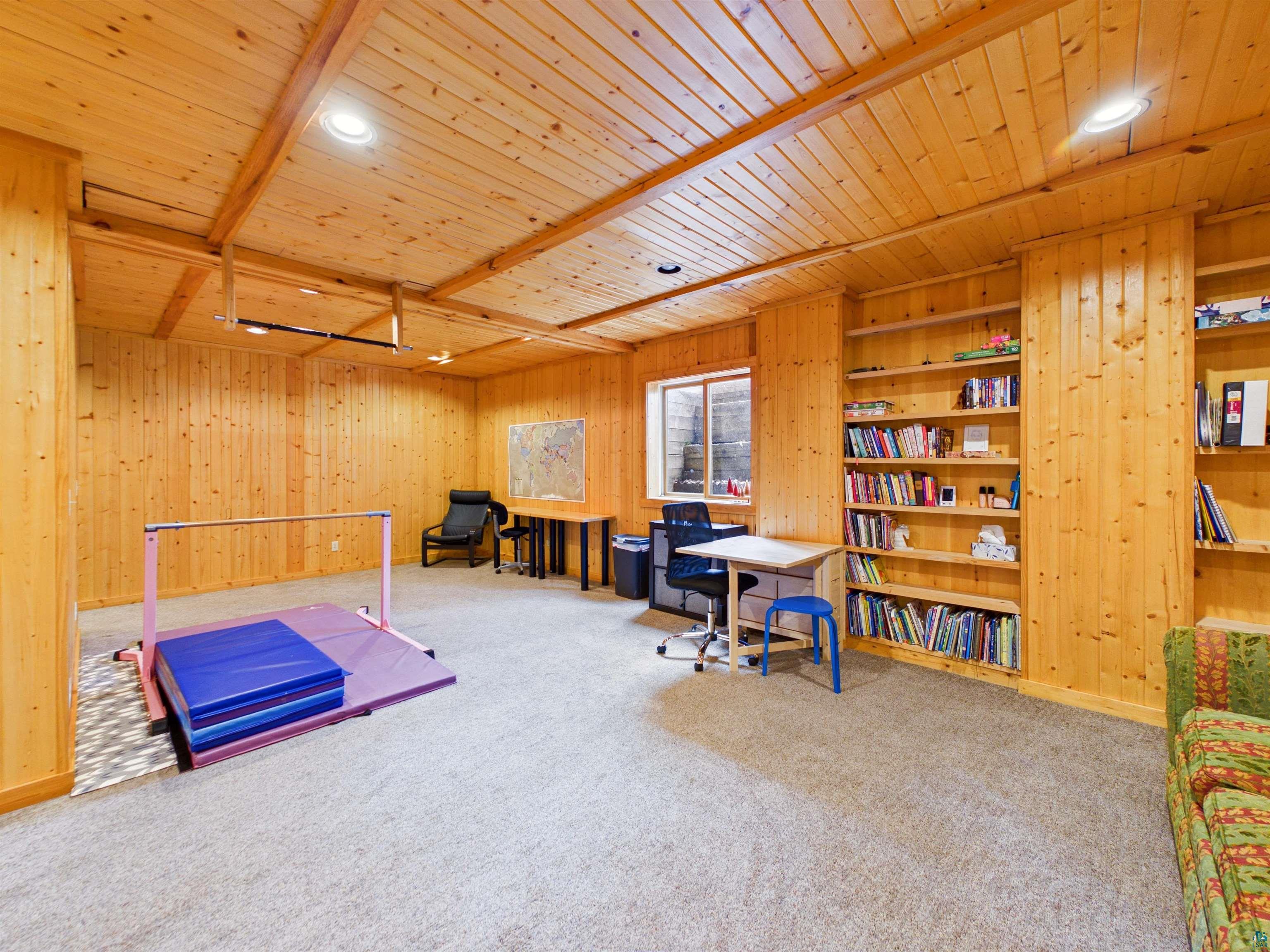 16539 Acorn Ridge Hayward, WI 54843 - Photo 46 of 58 Office area with recessed lighting, carpet, wooden walls, a wooden ceiling with exposed beams, and built in features