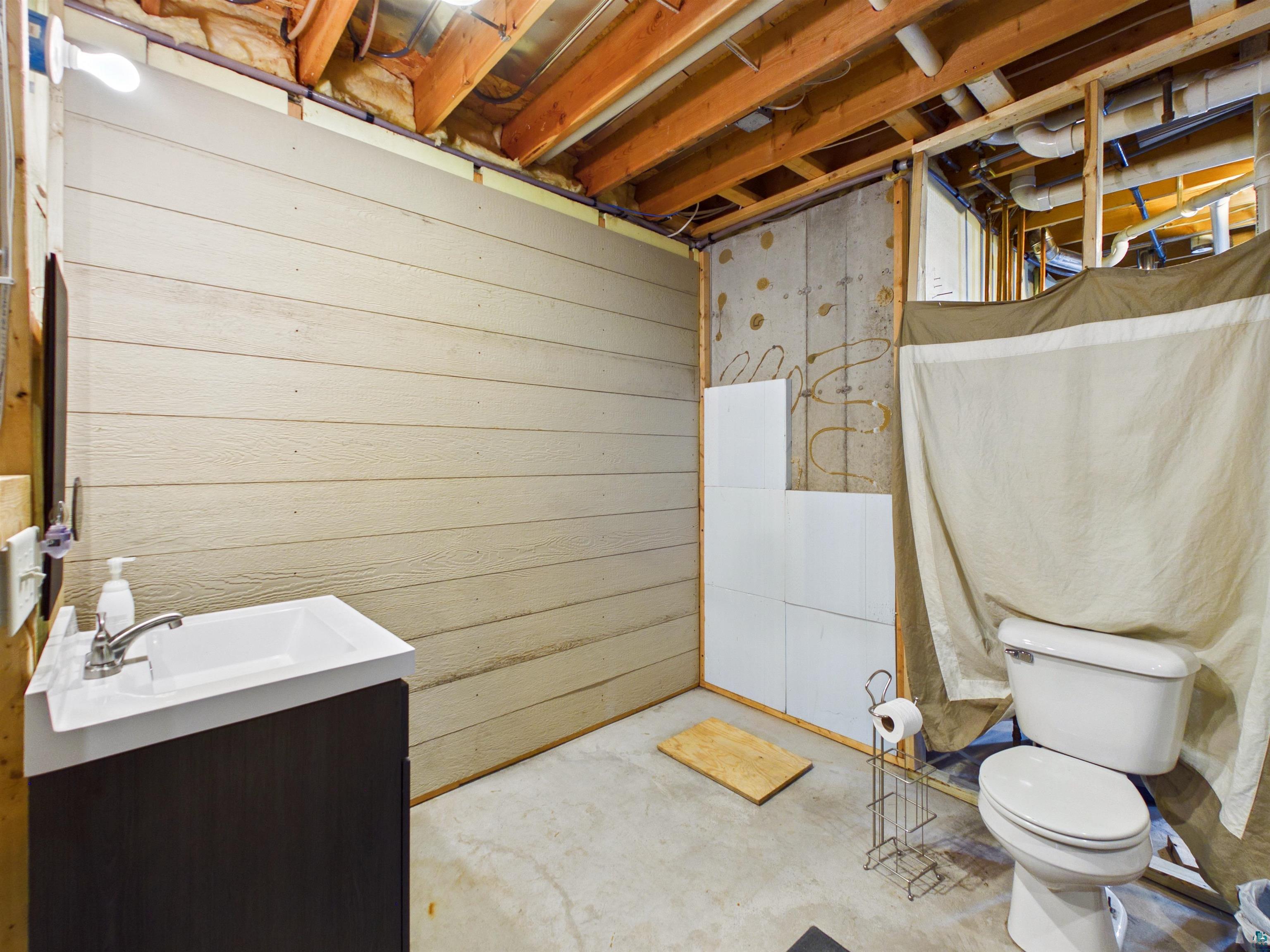 16539 Acorn Ridge Hayward, WI 54843 - Photo 48 of 58 Bathroom featuring vanity and unfinished concrete flooring