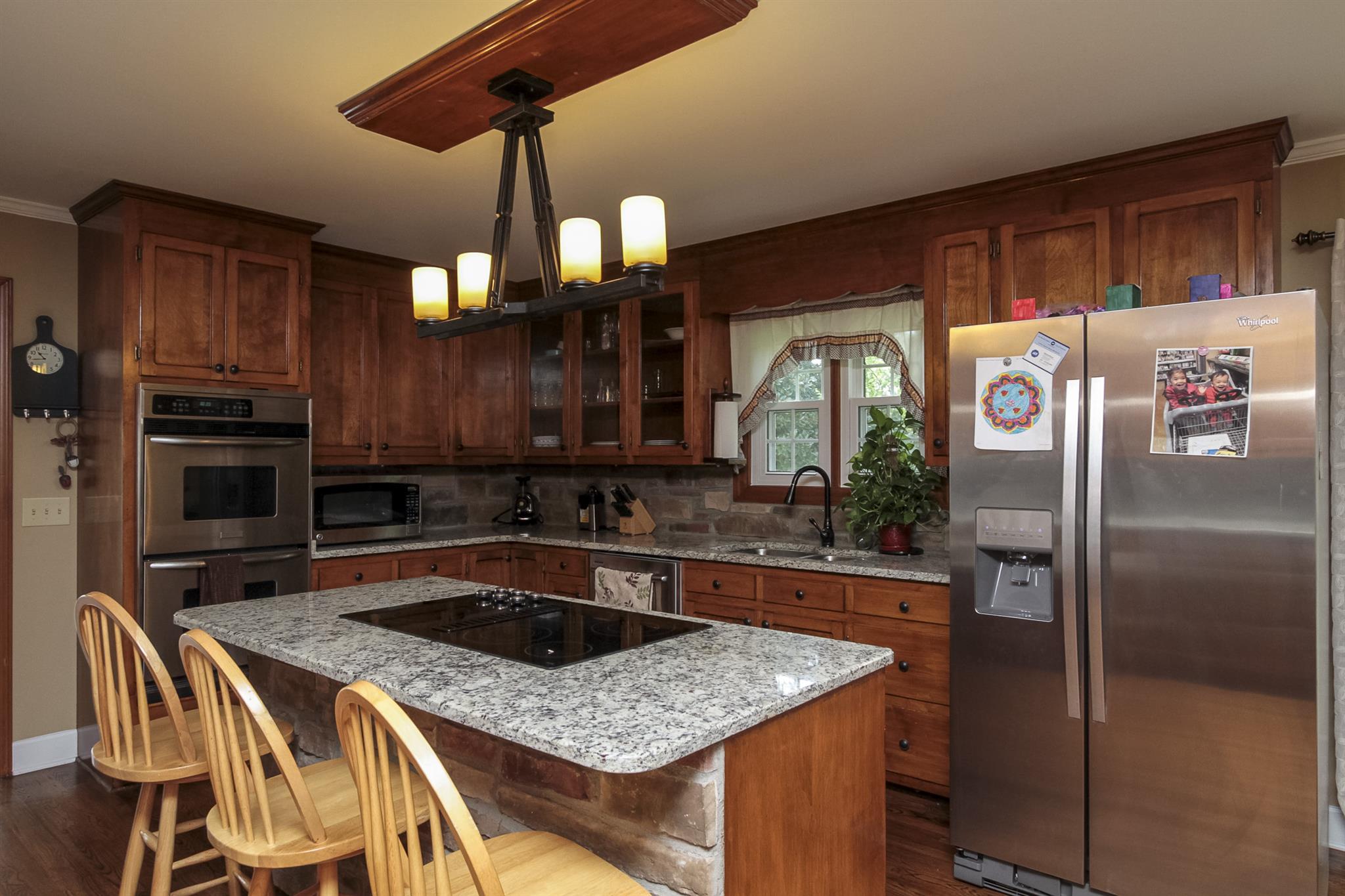 962 Alford Road Murfreesboro, TN 37129 - Photo 11 of 29 a kitchen with stainless steel appliances granite countertop a sink a stove and a refrigerator