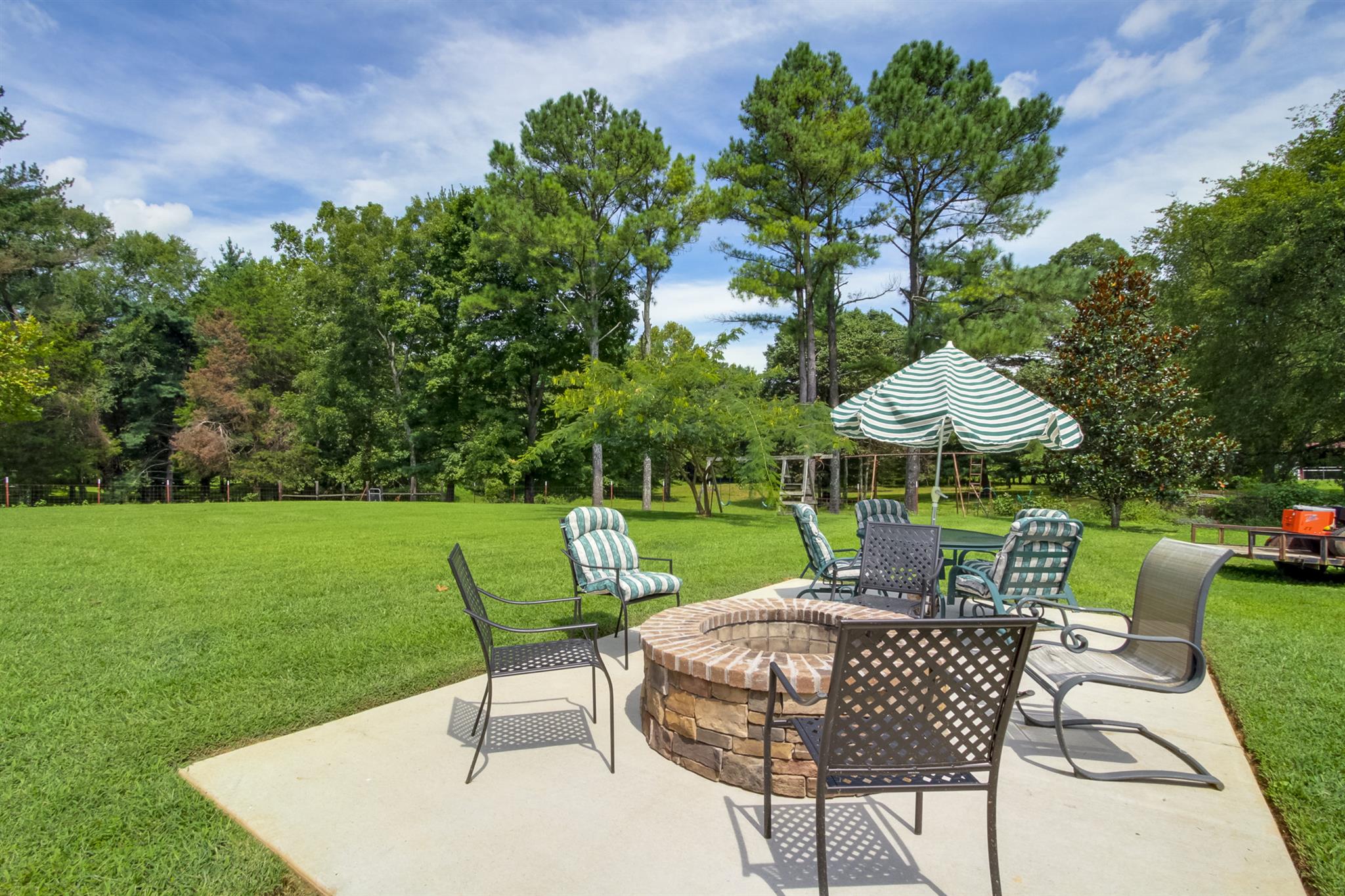 962 Alford Road Murfreesboro, TN 37129 - Photo 29 of 29 a view of a table and chairs under an umbrella