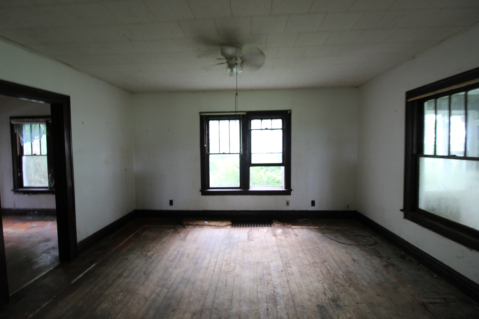 3523 West 2000 S Road Kankakee, IL 60901 - Photo 11 of 20 an empty room with wooden floor and windows