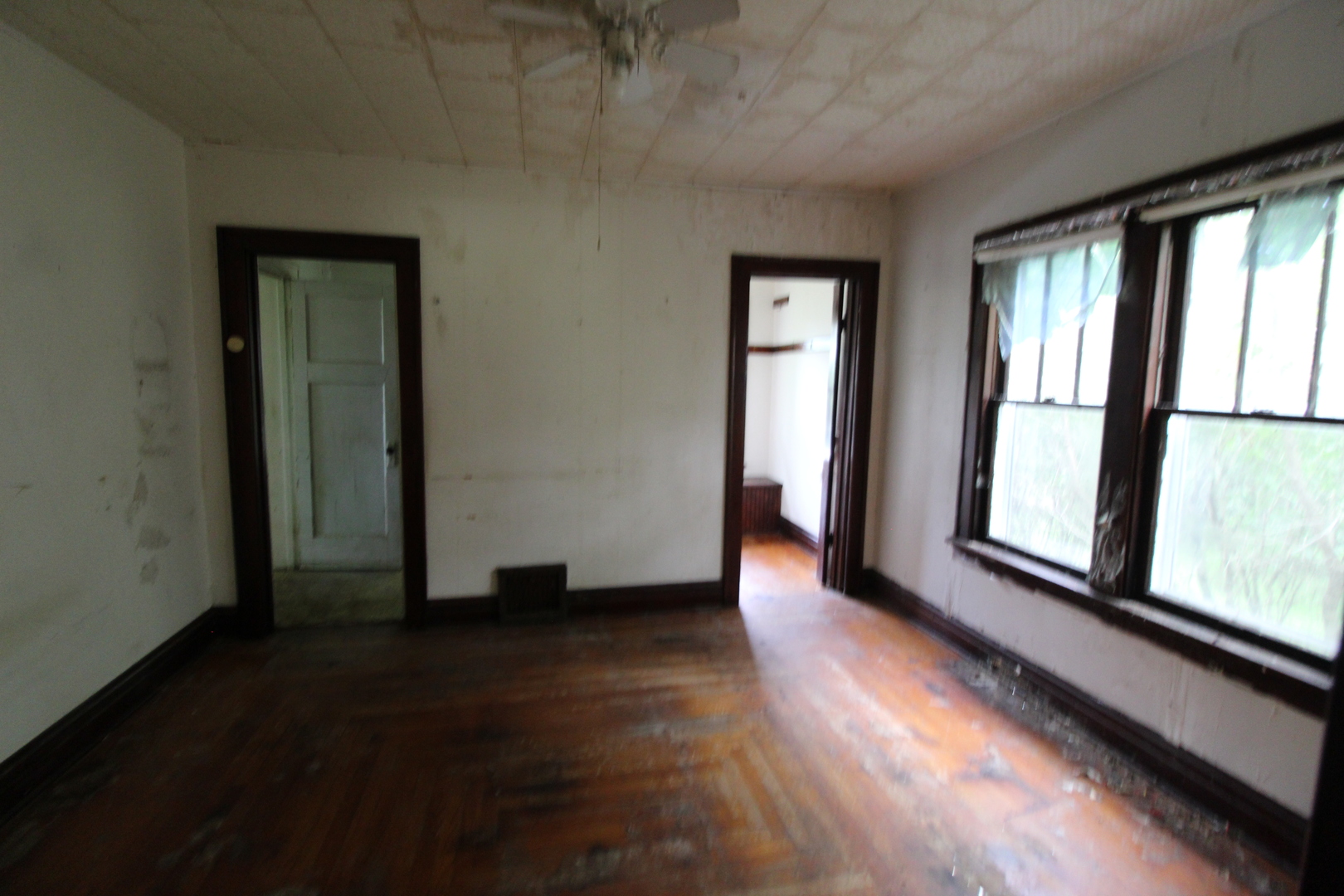 3523 West 2000 S Road Kankakee, IL 60901 - Photo 12 of 20 an empty room with wooden floor and windows