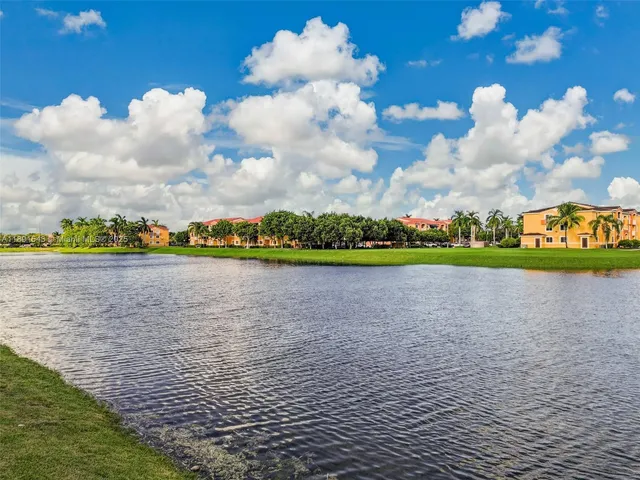 an aerial view of a house with a lake view