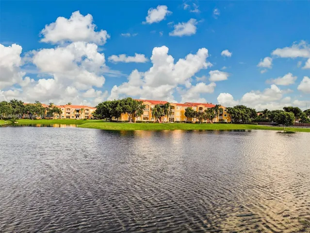 an aerial view of a house with a lake view