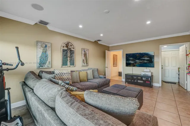 a kitchen with stainless steel appliances granite countertop a refrigerator stove and sink