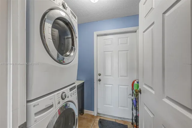 a view of a hallway to a dresser and mirror