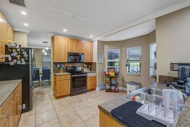 a view of a dining room with furniture and window