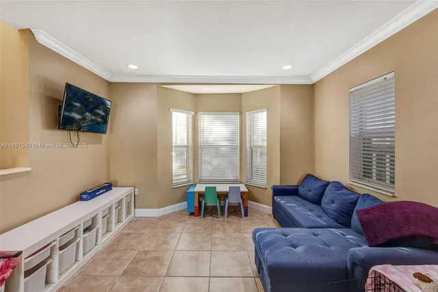 a view of a patio with a table and chairs