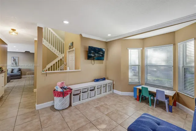 a view of a patio with a table chairs under an umbrella
