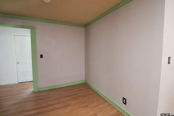 a view of a small space with wooden floor