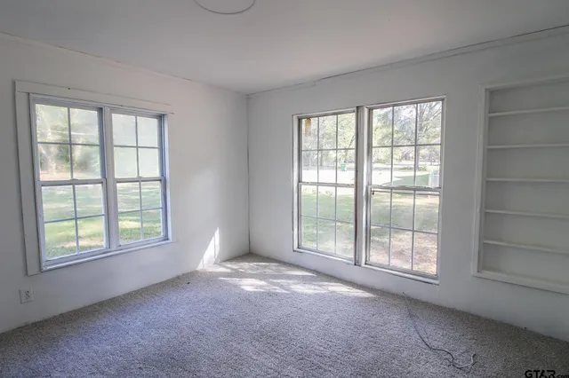 an empty room with windows