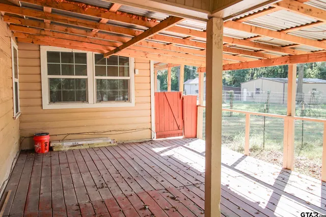 a view of porch with wooden floor and city view