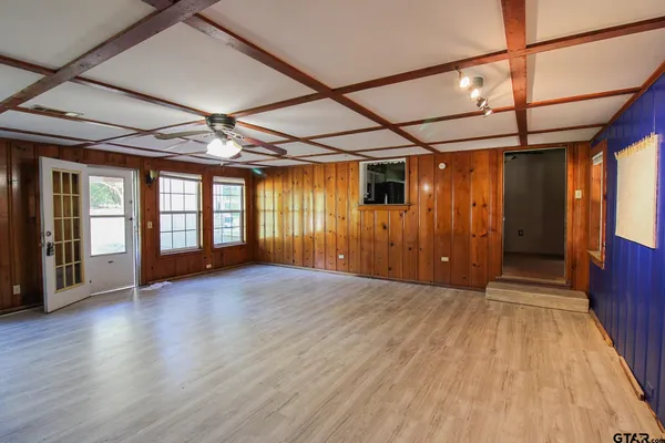 a view of hallway with wooden floor