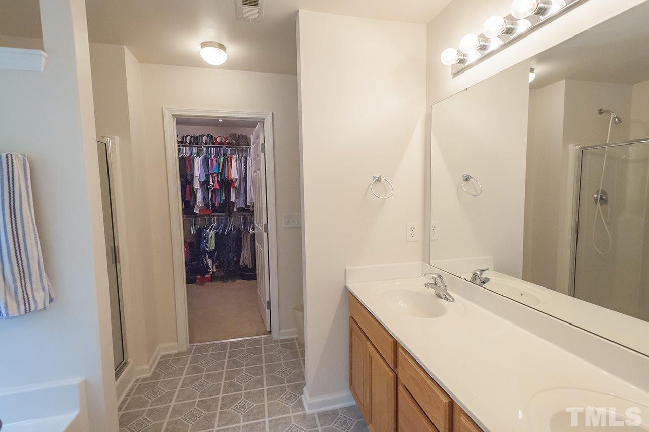 3239 Polite Lane Raleigh, NC 27610 - Photo 11 of 17 a bathroom with a sink and a mirror