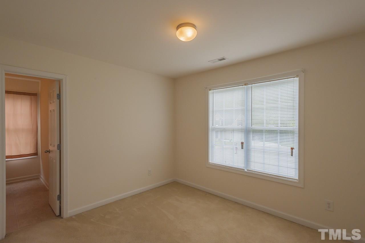 3239 Polite Lane Raleigh, NC 27610 - Photo 13 of 17 an empty room with windows and closet