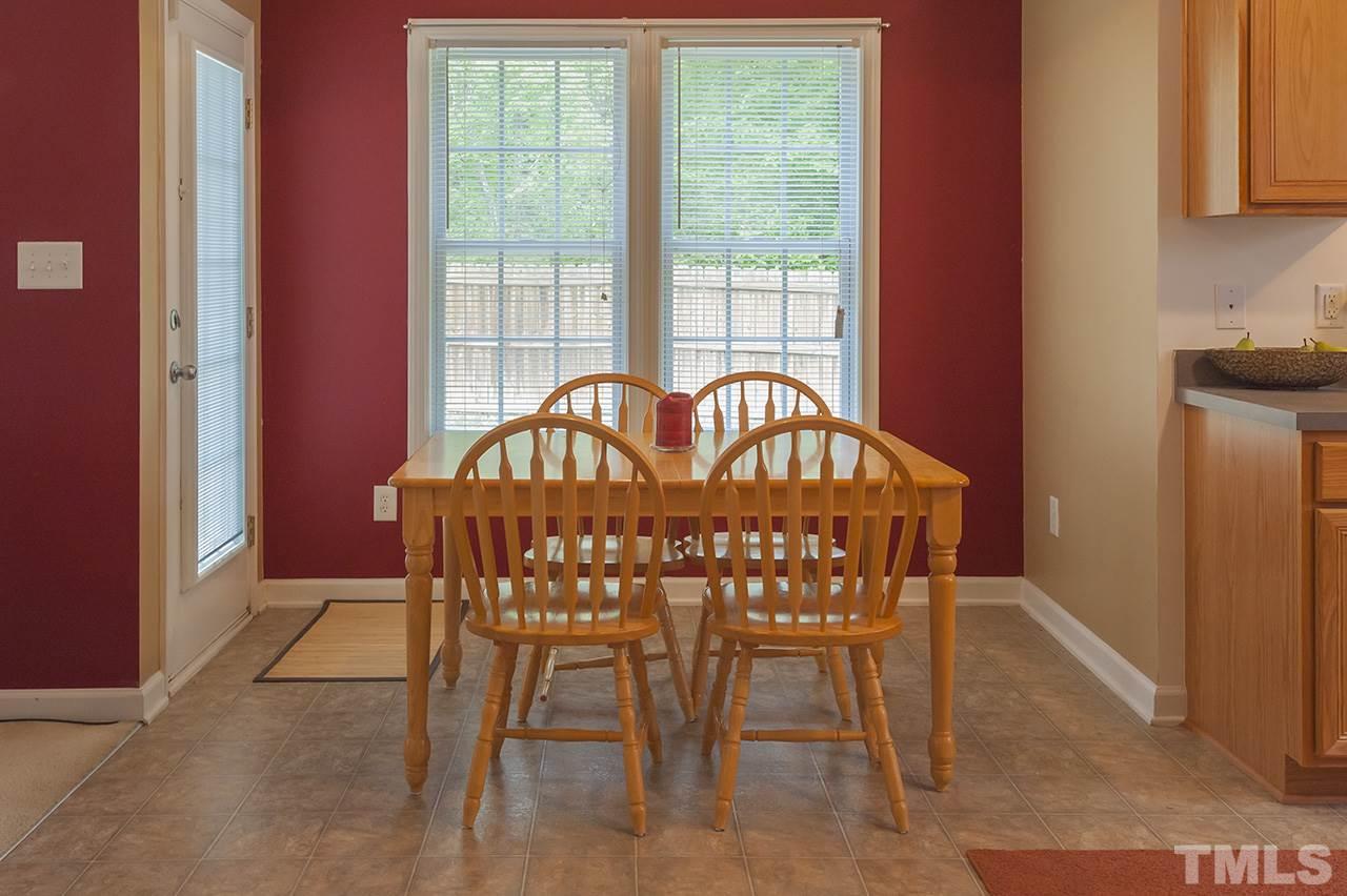 3239 Polite Lane Raleigh, NC 27610 - Photo 4 of 17 a view of a dining room that has a table and chairs in it