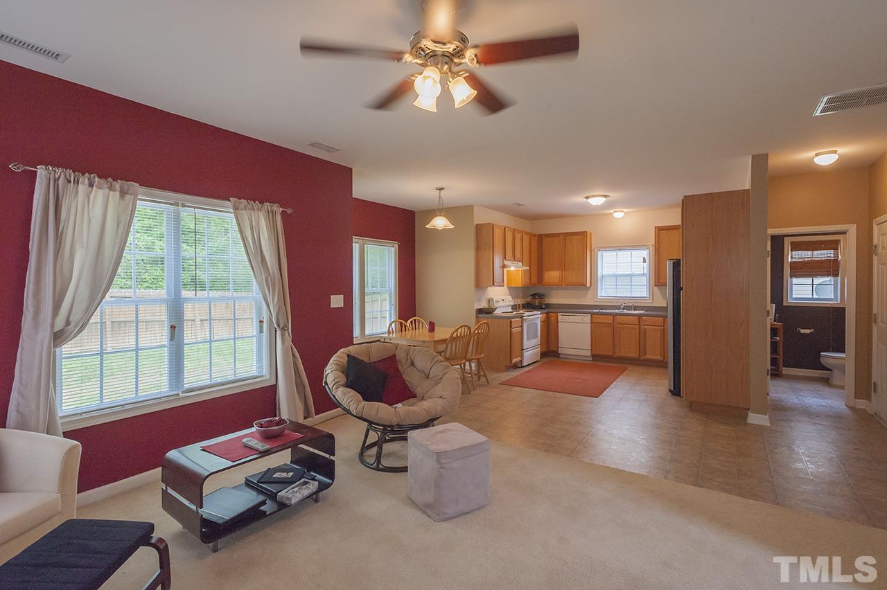 3239 Polite Lane Raleigh, NC 27610 - Photo 7 of 17 a living room with furniture and a large window