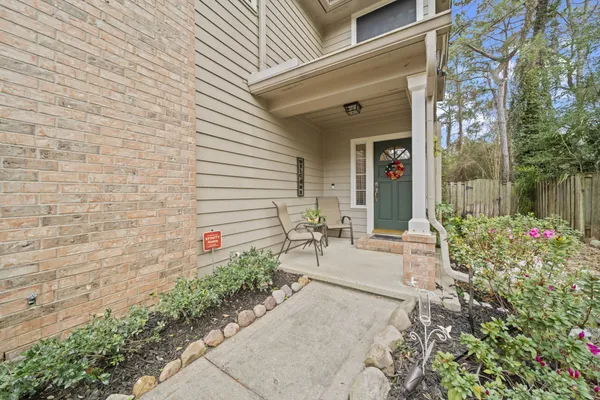 a view of a porch with seating space