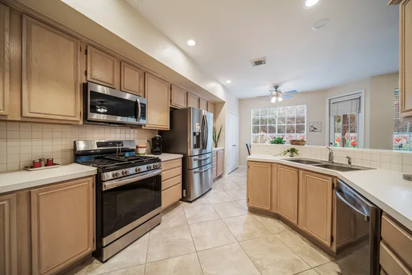 a spacious bathroom with a double vanity sink and a mirror