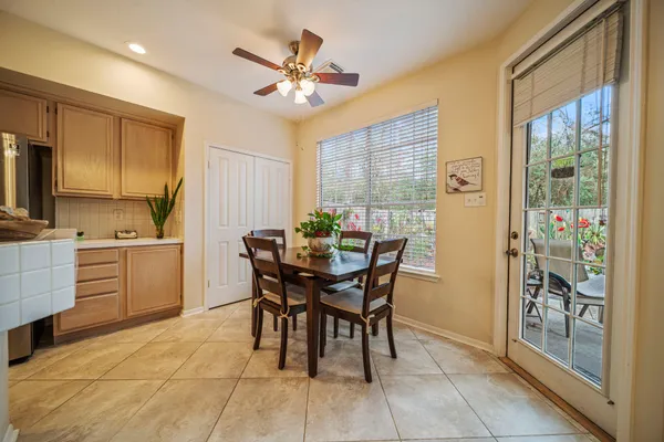 a view of a porch with chairs and backyard