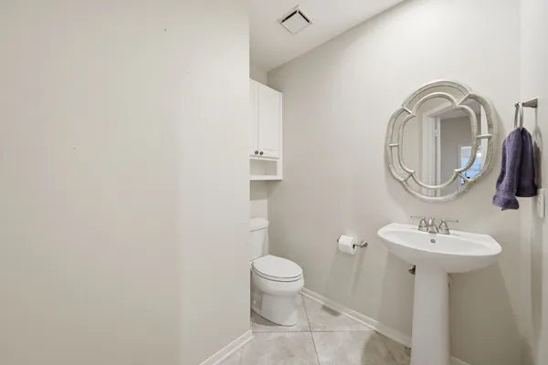 a living room with furniture a rug and a window