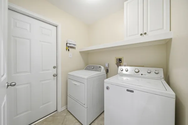 a view of a dining room with furniture and a kitchen