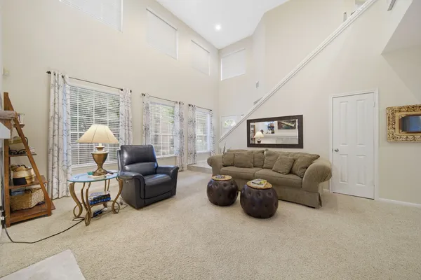a view of a workspace with furniture and a bookshelf