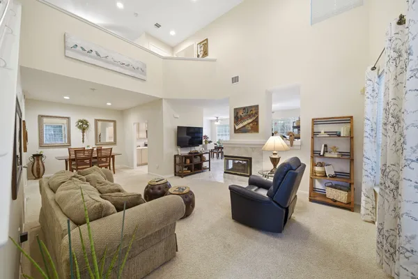a bed room with a bed and a chandelier